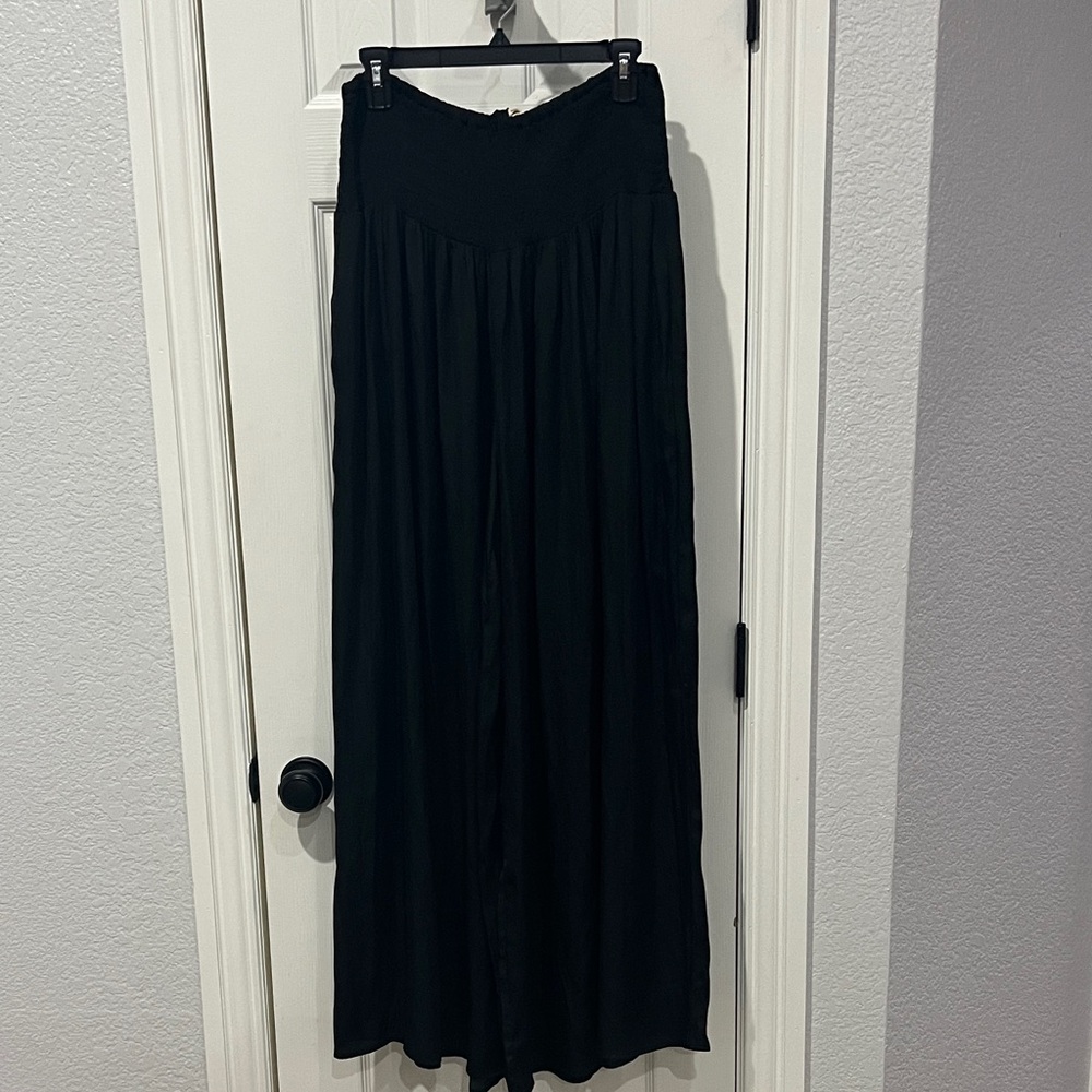 Elegant Black Super Wide Leg Boho style pants with pockets.